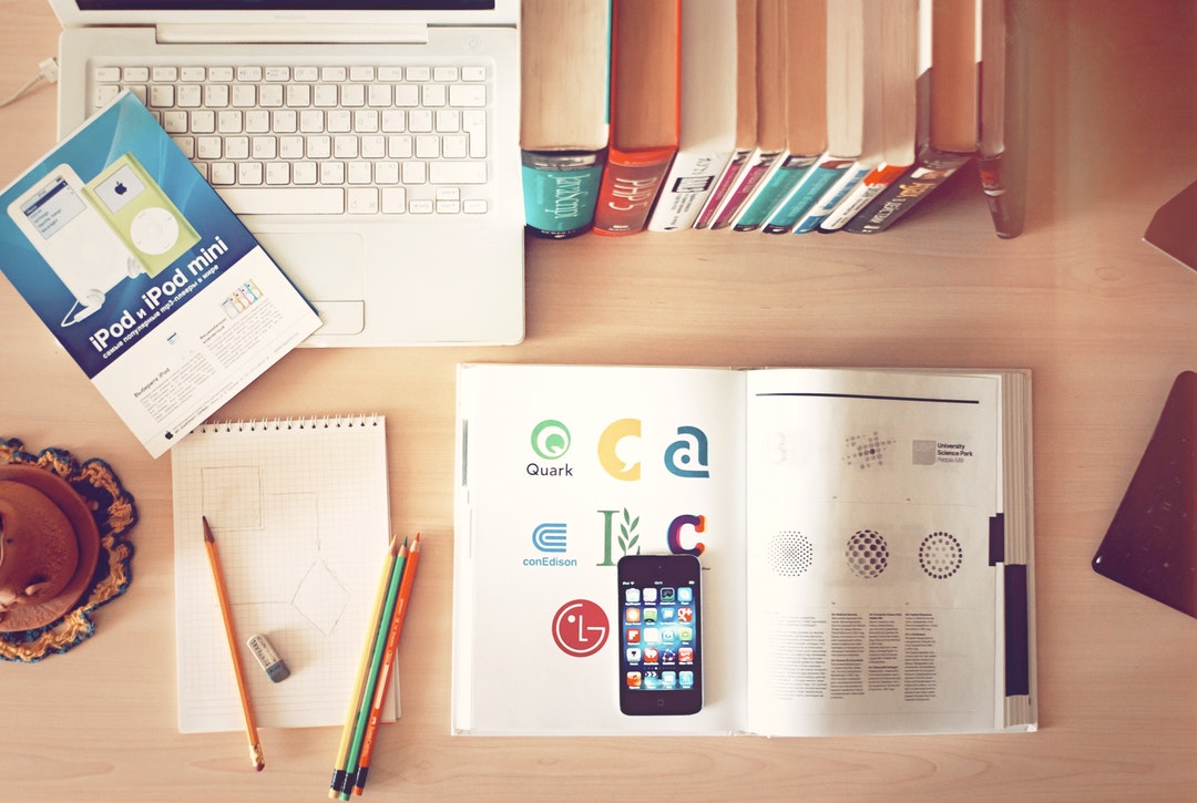 book with logos on desk