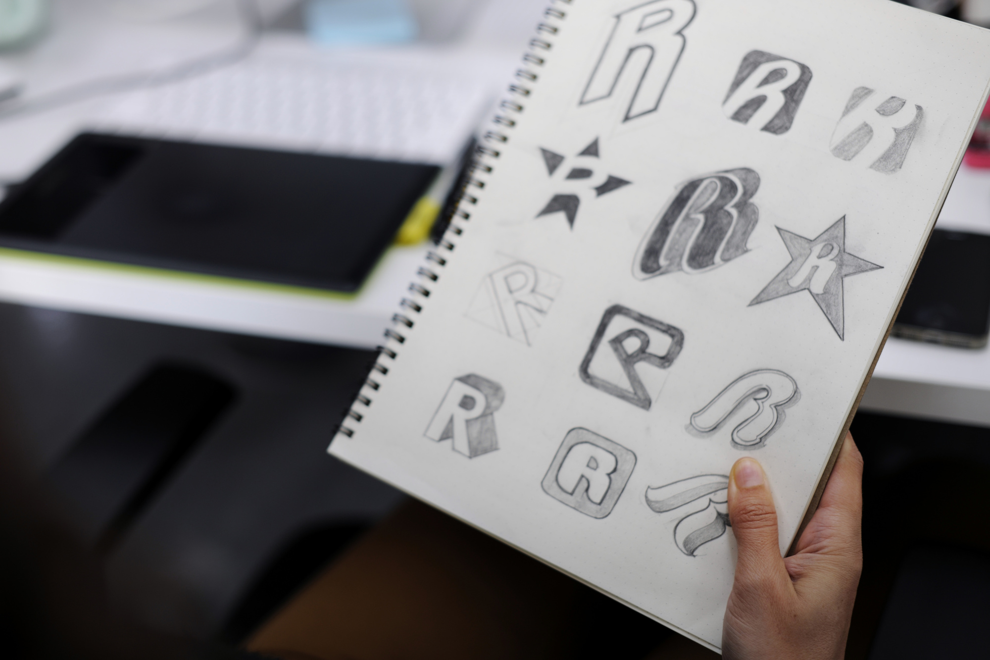 logo sketches on notebook