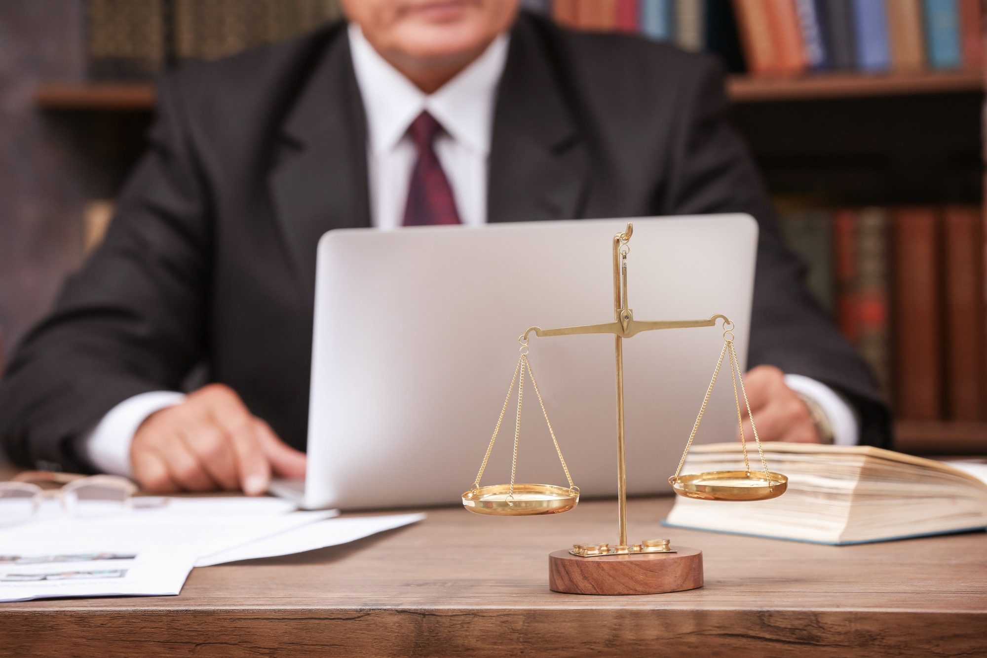 lawyer at desk with scale