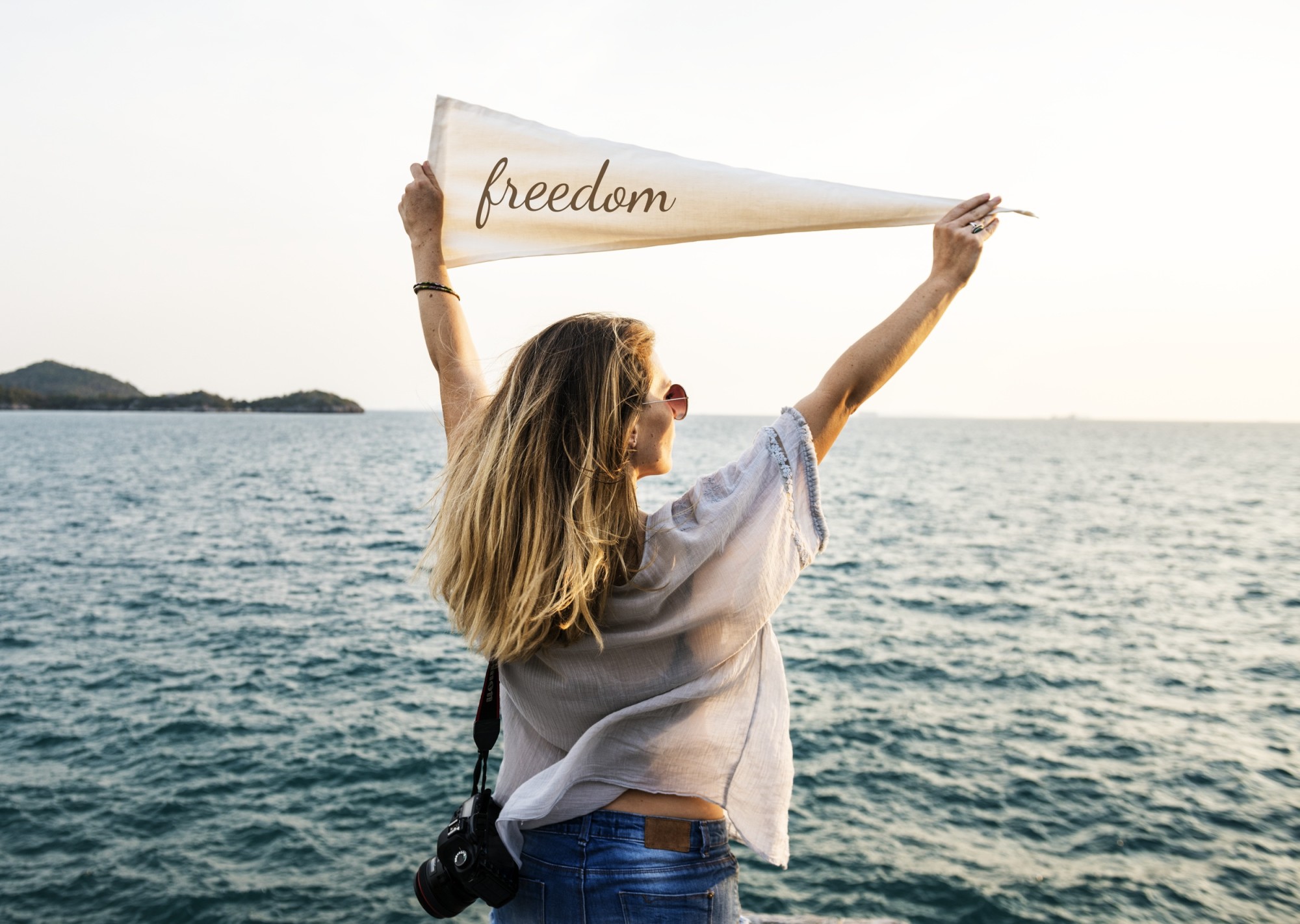 woman holding freedom flag